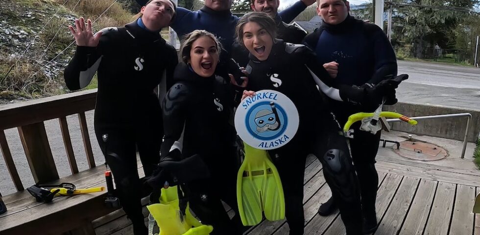 Family gets ready to snorkel on cruise excursion in Ketchikan Alaska