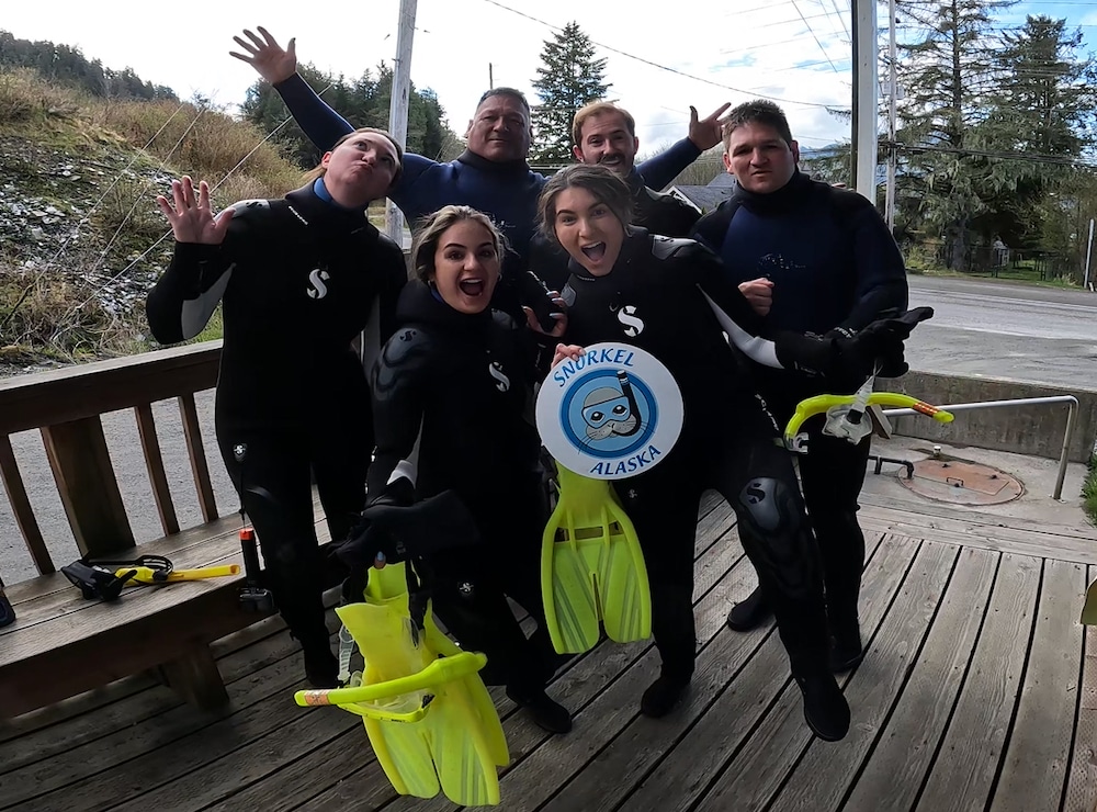 Family gets ready to snorkel on cruise excursion in Ketchikan Alaska